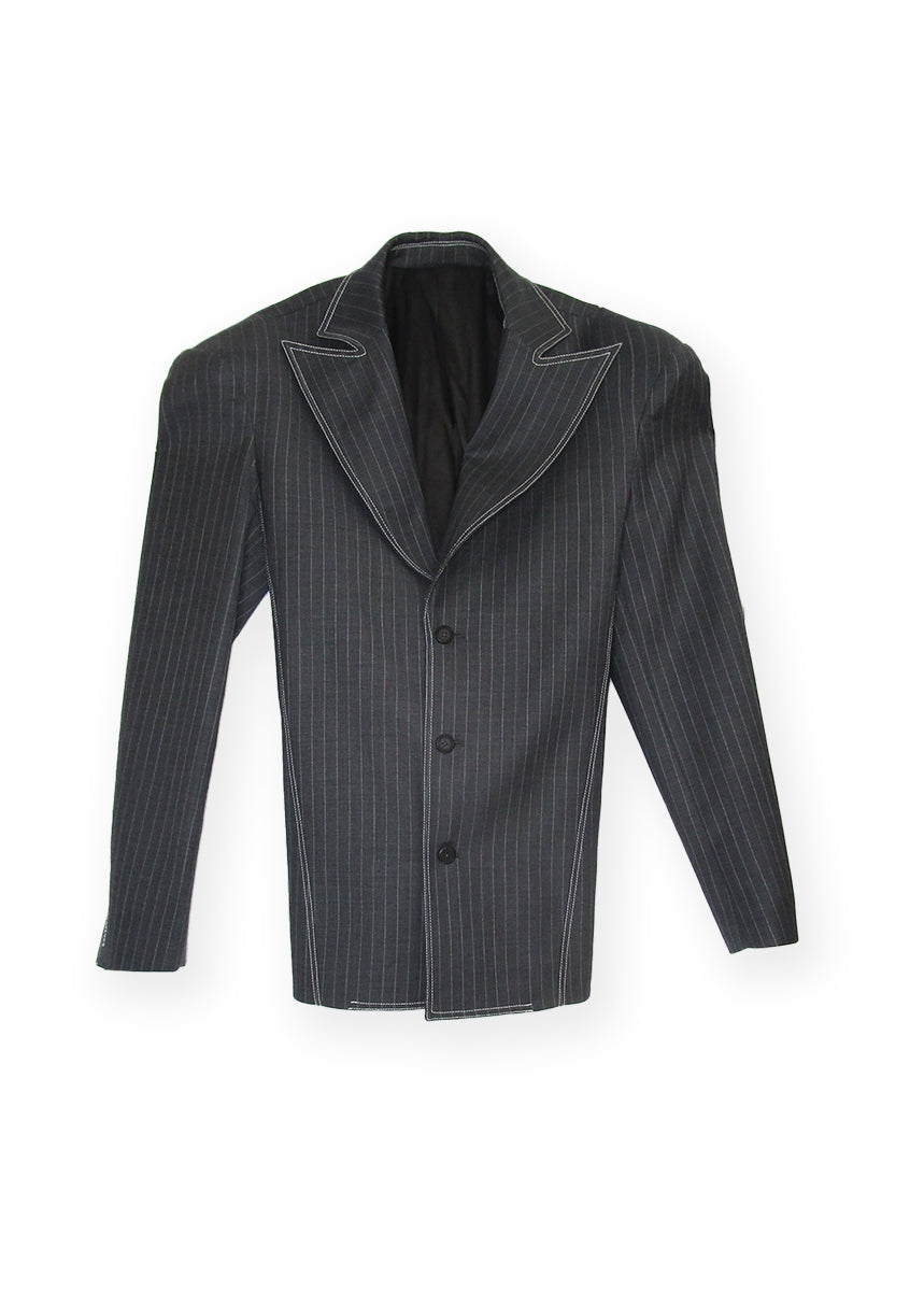 The Nectar wool blazer is a unique oversized and versatile addition to any wardrobe. Its removable straps allow for customisation of silhouette, oversized double stacked shoulder make a bold statement. Crafted from high-quality pin stripe wool, it's a stylish and comfortable choice for any occasion. Wool blend (dead stock), Single breasted, Removable back tie, Logo detail on sleeve 